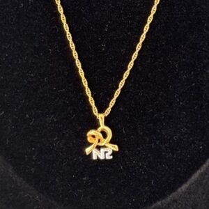 Vintage Nina Ricci Pretzel Ribbon Heart NR Logo Gold Tone Necklace